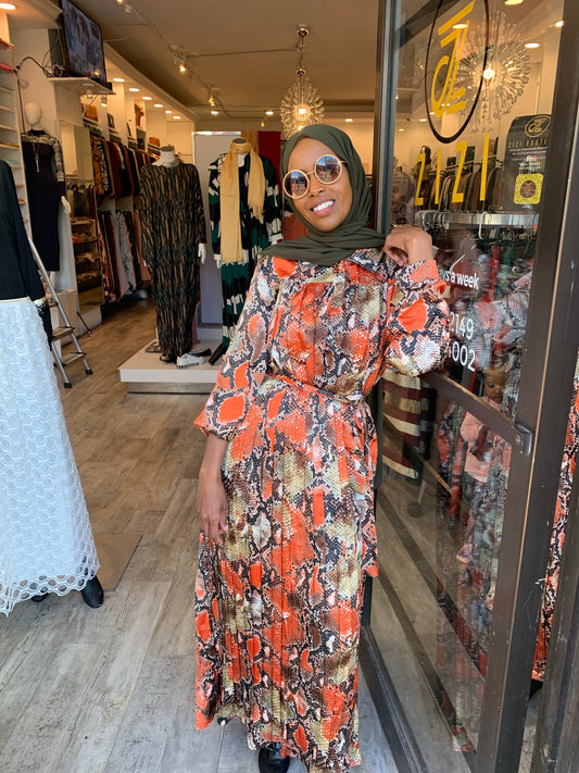 ZIZI Boutique Maxi Dress featuring a vibrant snake print design in orange and brown tones