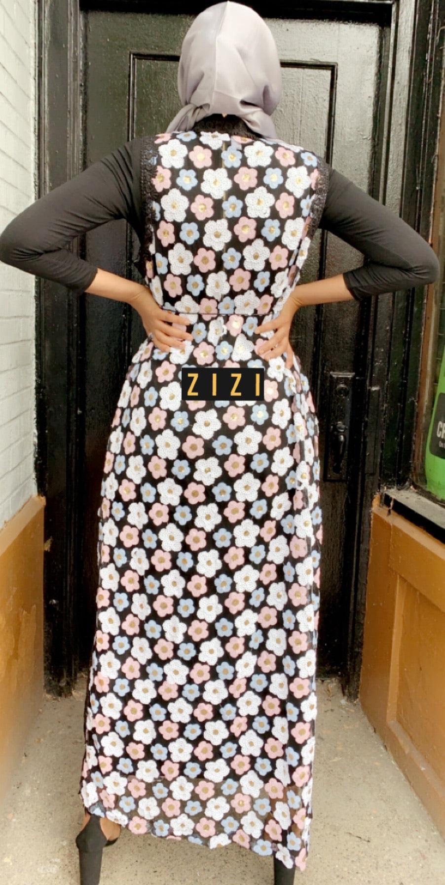 Design Abaya Sleeveless Black Multicolor Flowers, showcasing a unique floral pattern for stylish occasions