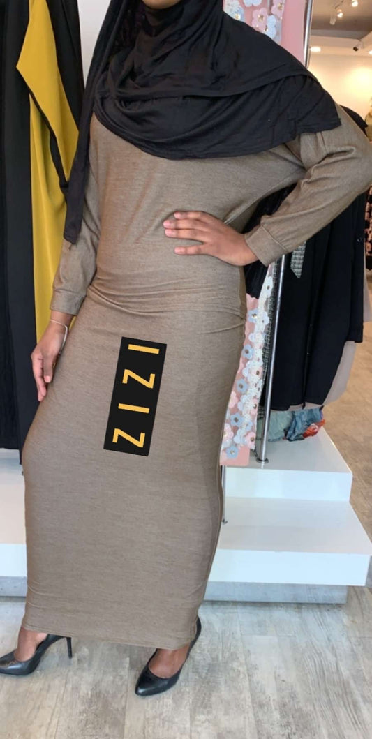 ZIZI Light Sweater & Skirt Set in beige worn with black heels and a black hijab