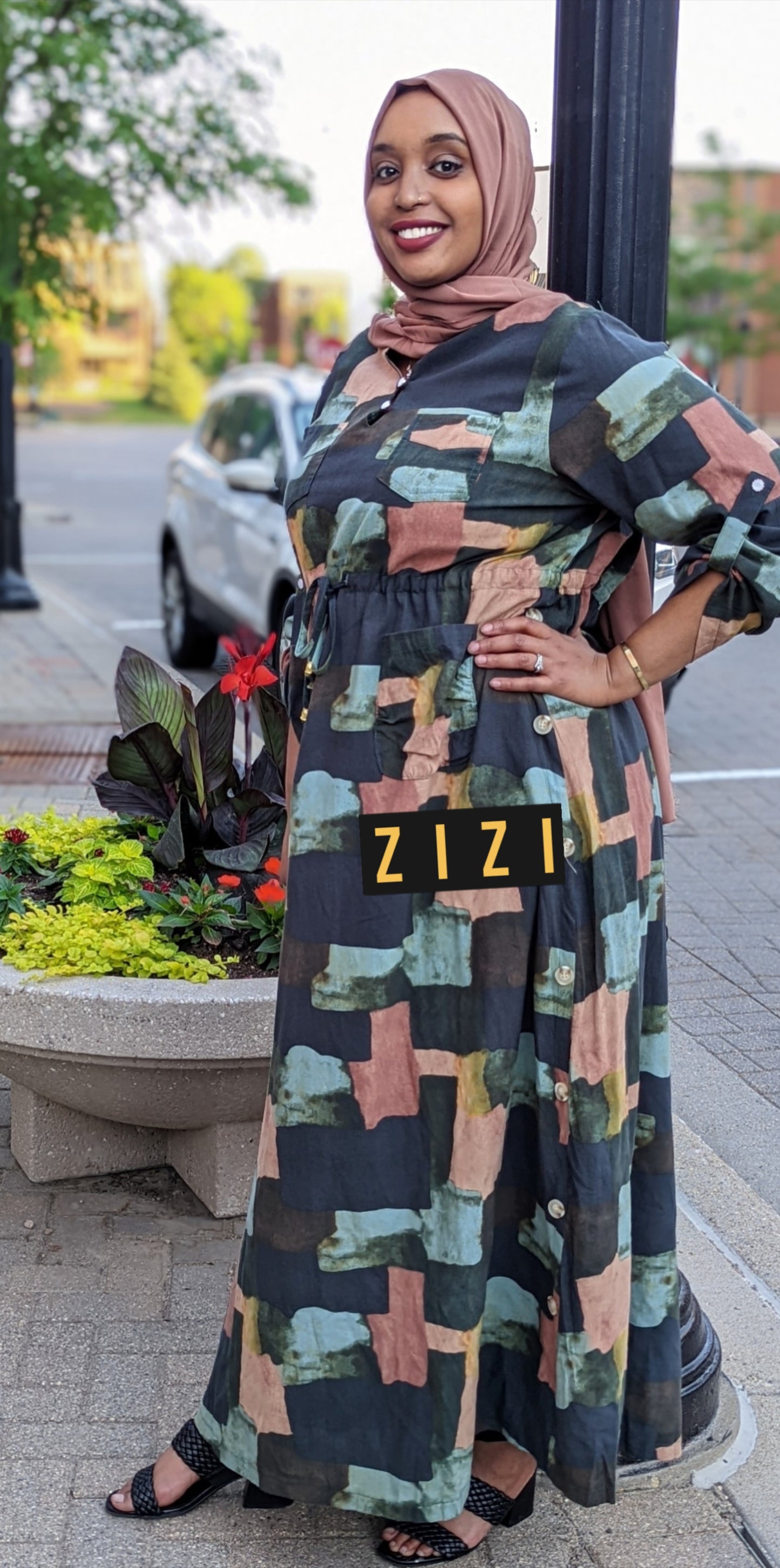 Woman wearing ZIZI Boutique ZZ Linen Dress Blocks Drawstring Print in abstract block pattern with long sleeves