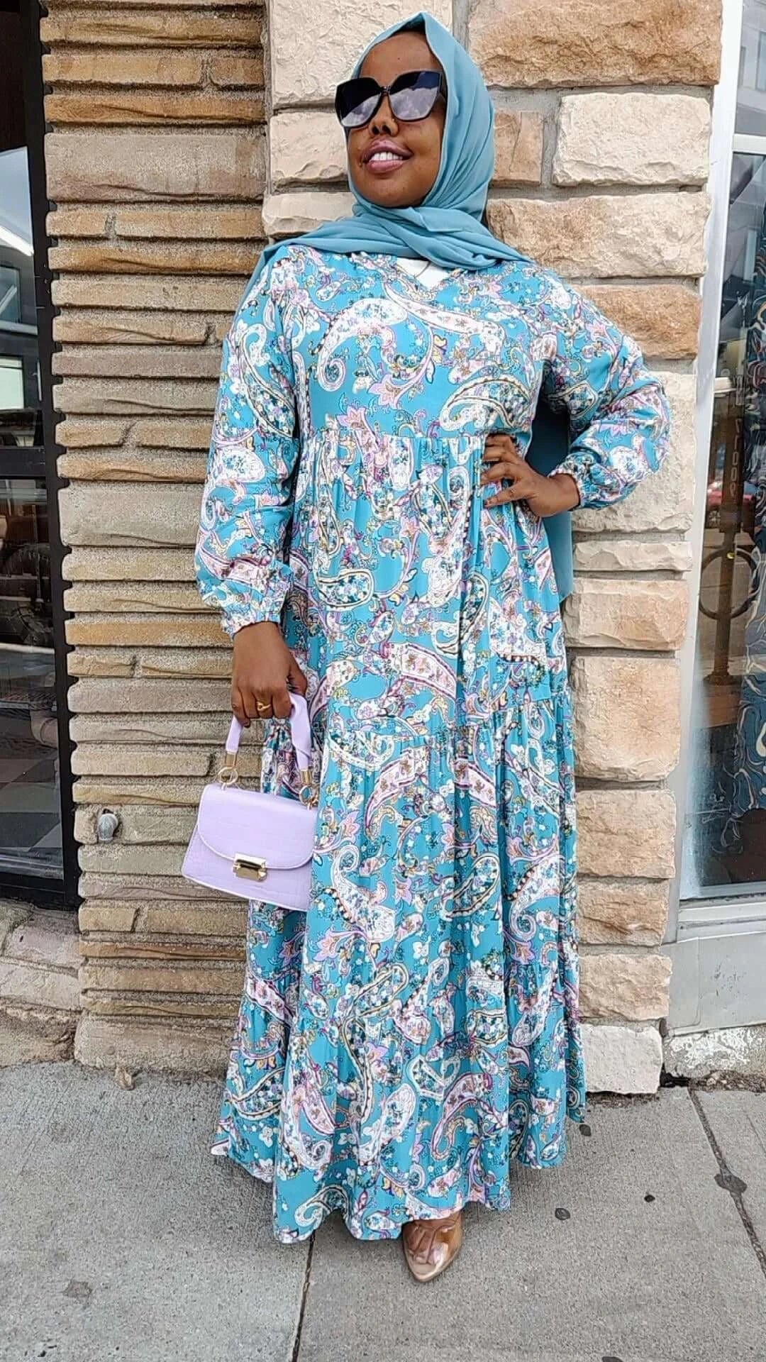 Anaam Print Maxi Dress in a Light Blue Turquoise Color with Paisley Print design available at ZIZI Boutique