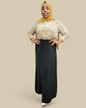 Hammer Women's Maxi Skirt with Pockets in black styled with patterned blouse and yellow headscarf