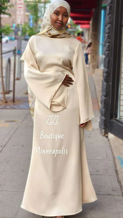 Zalina Satin Maxi Dress from ZIZI Boutique in cream satin evening dress with long sleeves and elegant fit
