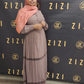 Woman wearing a taupe Hodan Lace Maxi Dress from ZIZI Boutique with a matching hijab posing indoors