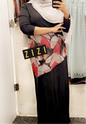 Elegant black maxi dress from ZIZI Boutique with stylish floral print and long sleeves