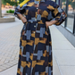 Woman wearing ZZ Linen Print Dress Blocks Print by ZIZI Boutique with abstract block design in black, brown, and gray colors