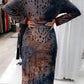 ZIZI Abaya Maxi Print Dress in brown and black with a floral pattern, worn with a light pink hijab