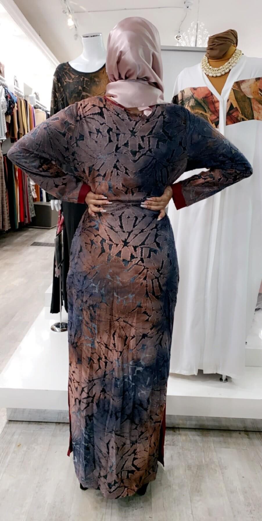 ZIZI Abaya Maxi Print Dress in brown and black with a floral pattern, worn with a light pink hijab
