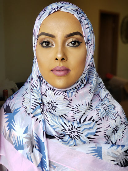 Woman wearing Baby Pink Silk Print Hijab with floral and geometric pattern from ZIZI Boutique