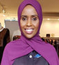 ZIZI Classic Chiffon Hijab Violet worn by a smiling woman showcasing the lightweight fabric