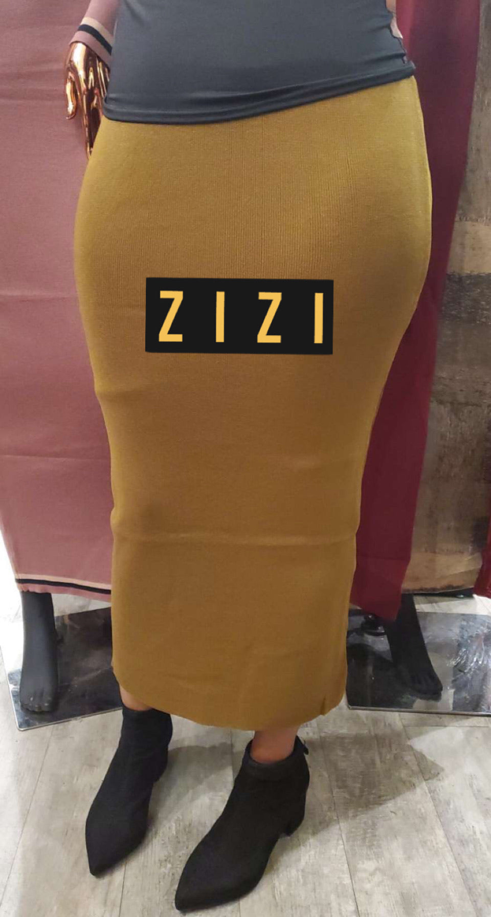 Free Size Women's Sweater Maxi Skirt in mustard yellow worn with black top and ankle boots