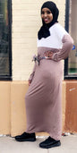 Woman wearing a Half Zipper Jersey Maxi Dress in taupe and white with a waist tie belt