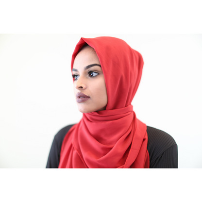 ZIZI red premium chiffon hijab online styled on woman with black top against white background