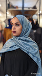 Sparkly XL Hijab Metallic Blue draped on woman wearing black outfit by ZIZI