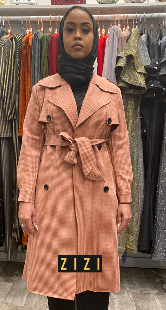 ZIZI Boutique Suede Trench Coat Pink with belted waist and double-breasted buttons worn by model