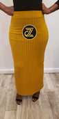 Wide Pinstripe Women's Maxi Skirt in mustard yellow worn with black top and sandals