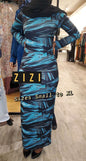 Model wearing a 906 Bodycon Print Zipper Dress from ZIZI Boutique in a vibrant abstract design