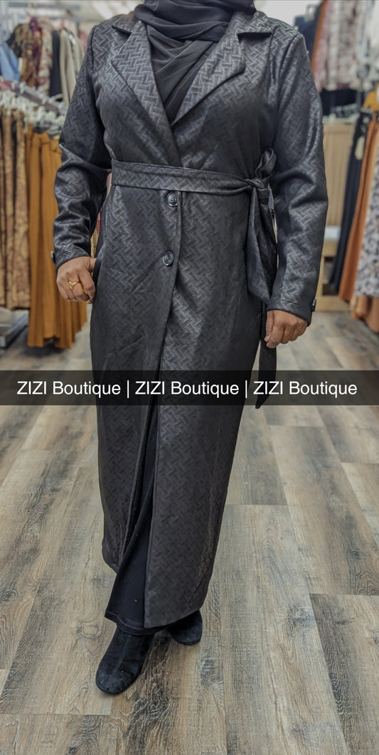 ZIZI Boutique black suede long coat with belt and button closure on model in store