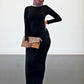 Model wearing a black Bodycon Zipper Maxi Dress Shapewear ZIZI Boutique with a stylish clutch and sneakers