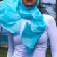 Model wearing a Bodycon Zipper Maxi Dress Shapewear ZIZI Boutique with a blue hijab outdoors