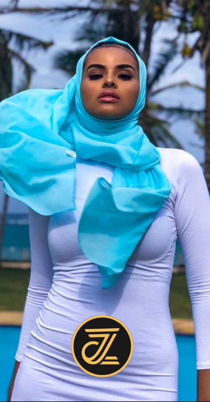 Model wearing a Bodycon Zipper Maxi Dress Shapewear ZIZI Boutique with a blue hijab outdoors
