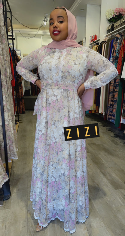 Elegant Chiffon Floral Print Maxi Dress from ZIZI Boutique, featuring long sleeves and a flowing design
