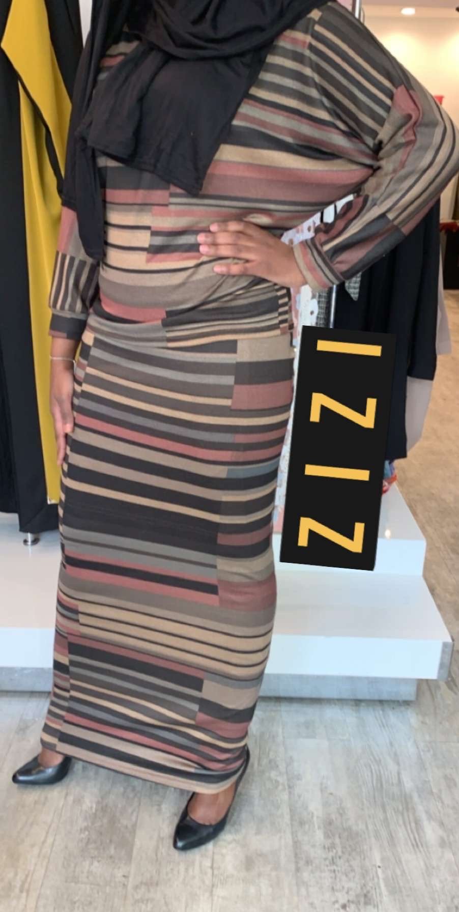 ZIZI light sweater and skirt set with multi-color horizontal and vertical stripes worn by model