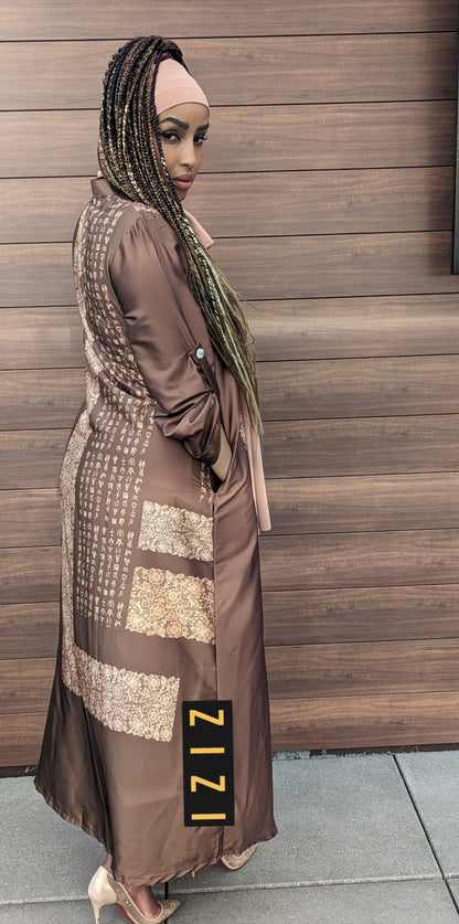 Woman wearing a Satin Silk Maxi Print Dress Shirt by ZIZI Boutique with detailed patterns and long sleeves