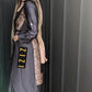 Woman wearing a Satin Silk Maxi Print Dress Shirt with snake print details and long sleeves